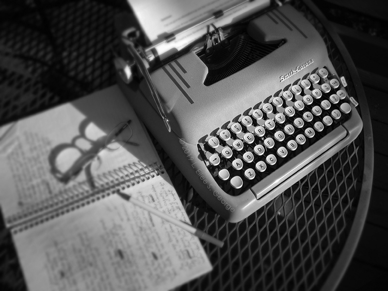 My Smith-Corona &amp; notebook on the back deck © 2019 L. Eilee S. George